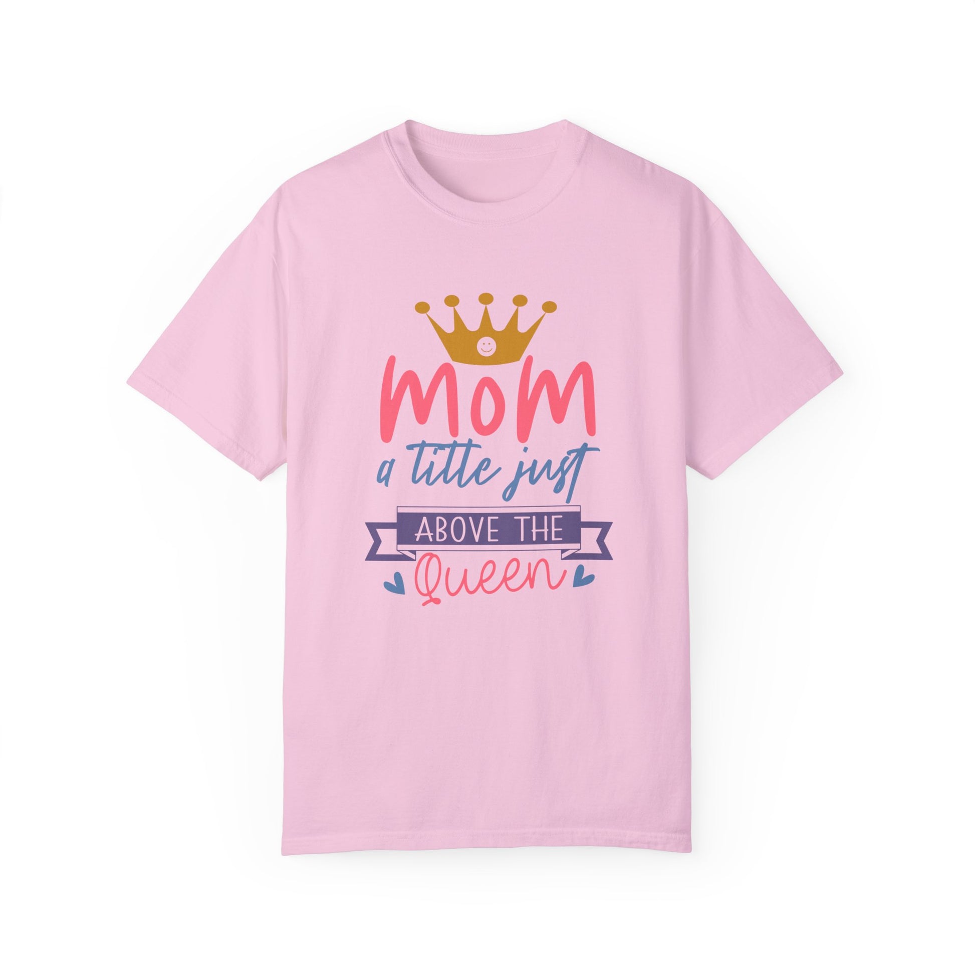 The Stylish Comfort Unisex Comfort Colors 1717 Garment-Dyed T-Shirt, named "mom just a little above queen," is crafted from ring-spun cotton in pink. It features a crown graphic alongside the text: "Mom, a title just above the queen." This tee offers both cherished comfort and a relaxed fit with its exceptionally soft touch.