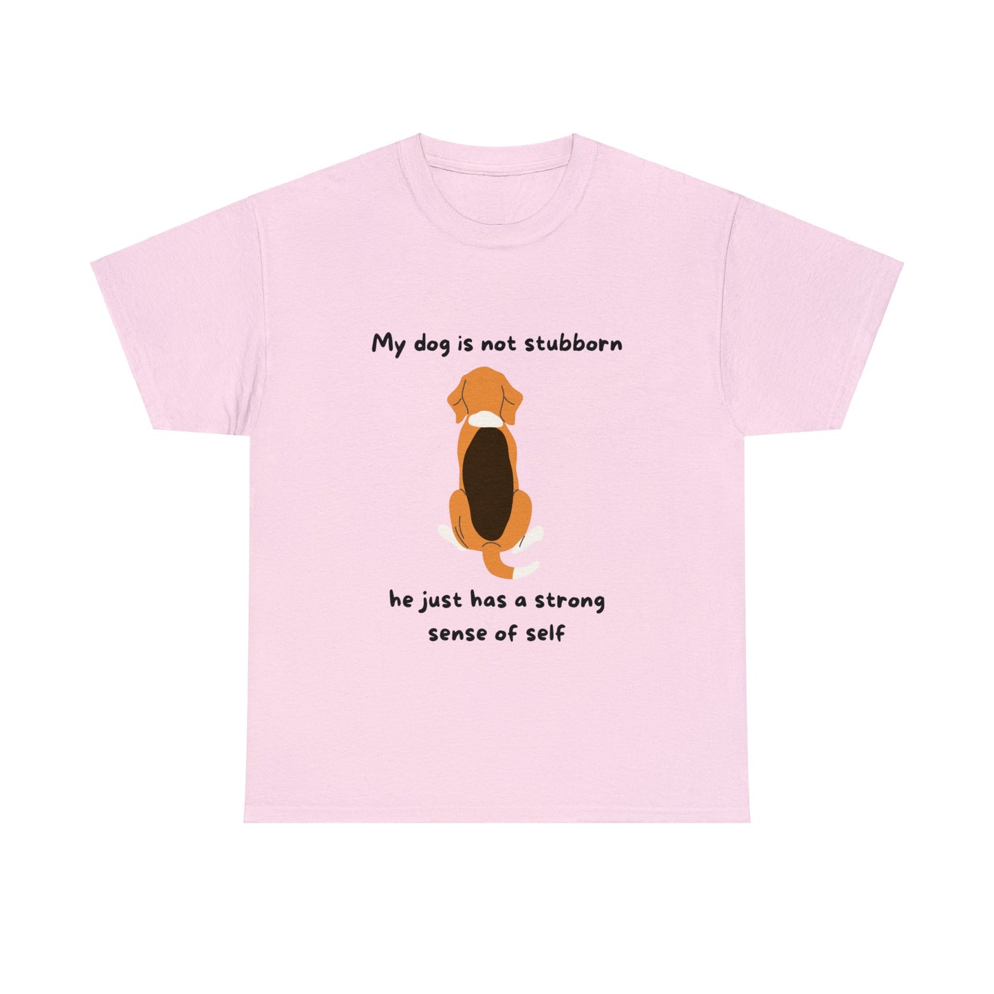 The "Unisex Heavy Cotton Tee - MY DOGS NOT STUBBORN- BEAGLE2" is a pink T-shirt made from 100% cotton, featuring an illustration of a sitting dog accompanied by the phrase "My dog is not stubborn, he just has a strong sense of self," in a classic fit design.