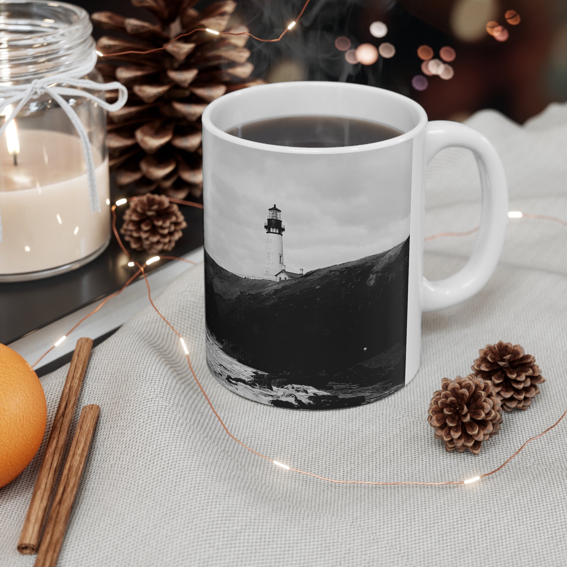 11oz white coffee cup with a black and white picture of a lighthouse on the oregon coast in Newport