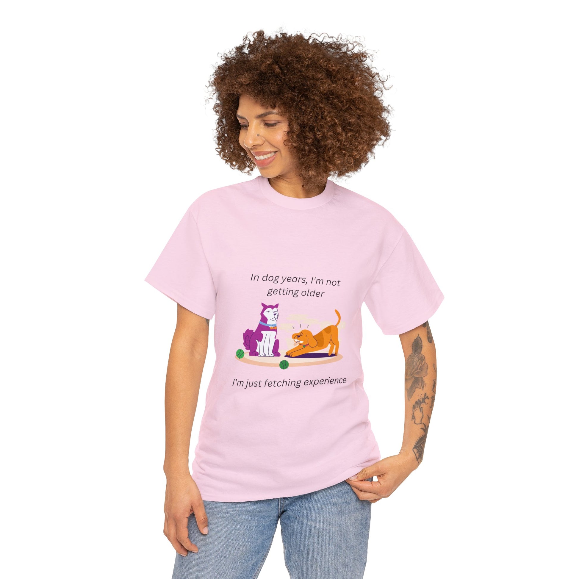 pink shirt that says 'I'm not getting old; in dog years I'm fetching experience.' With a silly cartoon of two dogs. One serious, the other playful