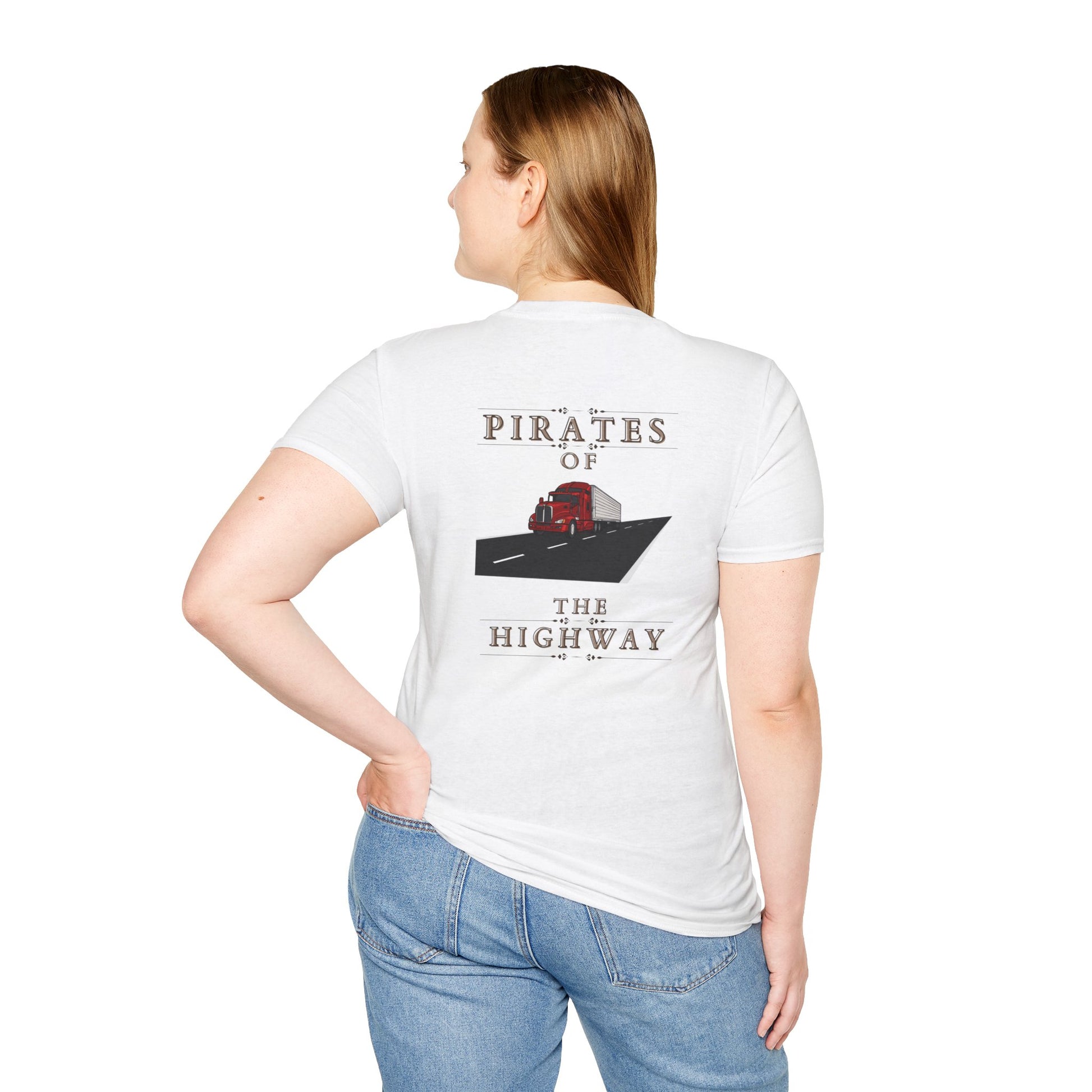 A person wearing a "Unisex Softstyle T-Shirt- PIRATES OF THE HIGHWAY- RED TRUCK WITH VAN," which is a soft-style, white unisex t-shirt made of 100% cotton, featuring the "Pirates of the Highway" design and a red truck graphic on the back, standing against a plain background.