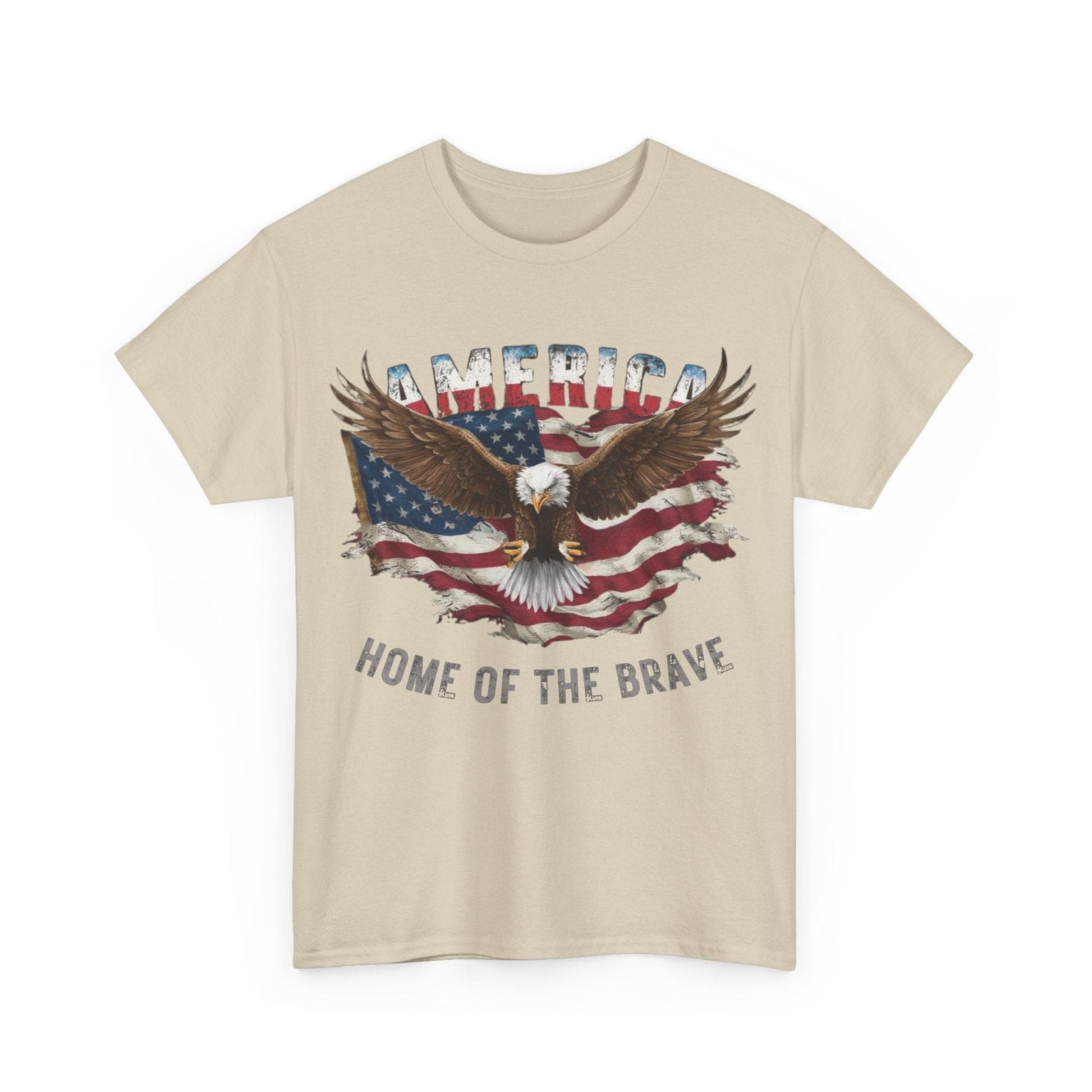 This Unisex Heavy Cotton Tee - AMERICA - FLAG AND EAGLE - HOME OF THE BRAVE features an eagle soaring in front of a tattered flag, with "America" above and "Home of the Brave" below. Made from sustainably sourced cotton, it offers comfort while showcasing your patriotic pride.