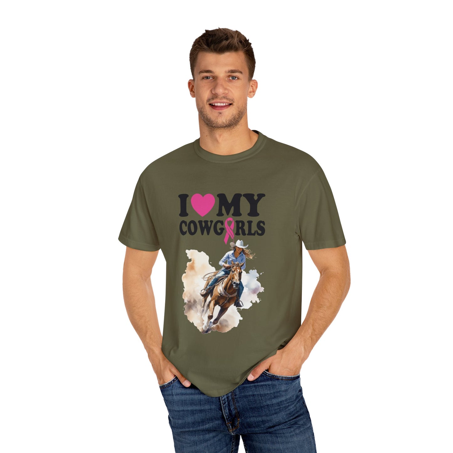 A young man smiles while wearing a Stylish Comfort with Unisex Comfort Colors 1717 Garment-Dyed T-Shirt- I LOVE MY COWGIRLS BREAST CANCER AWARENESS with the text "I ❤️ MY COWGIRLS" and an illustration of a cowgirl riding a horse.