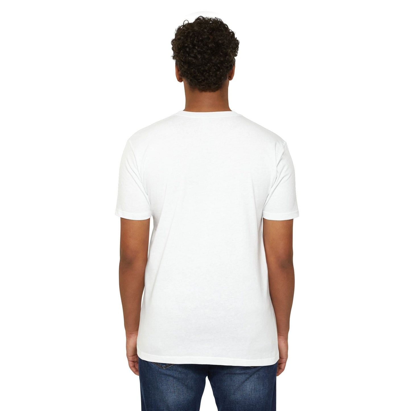 A person with curly hair is seen from the back, wearing a casual Alien CVC Jersey T-shirt - I COME IN PEACE and blue jeans against a white background.