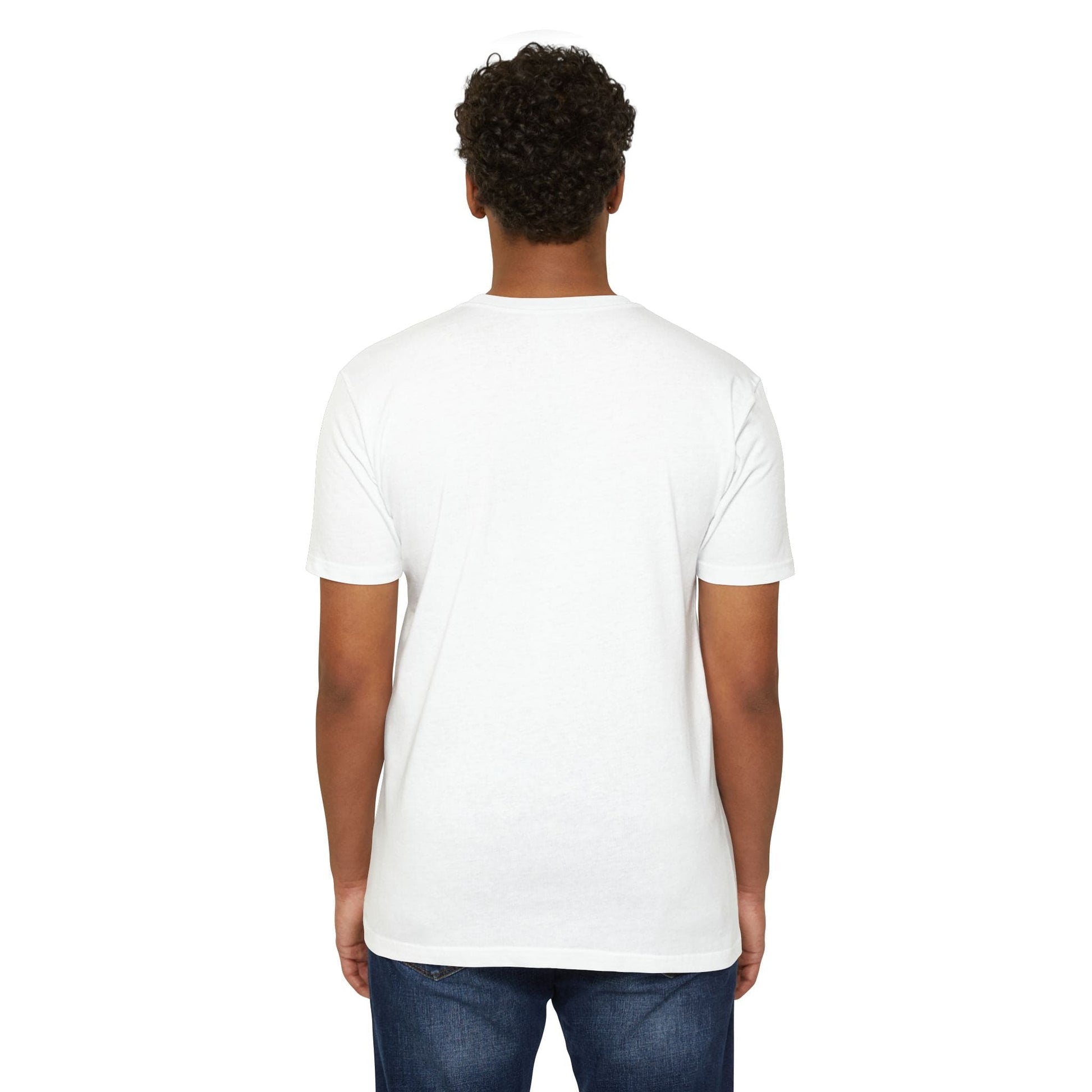 A person with curly hair is seen from the back, wearing a casual Alien CVC Jersey T-shirt - I COME IN PEACE and blue jeans against a white background.