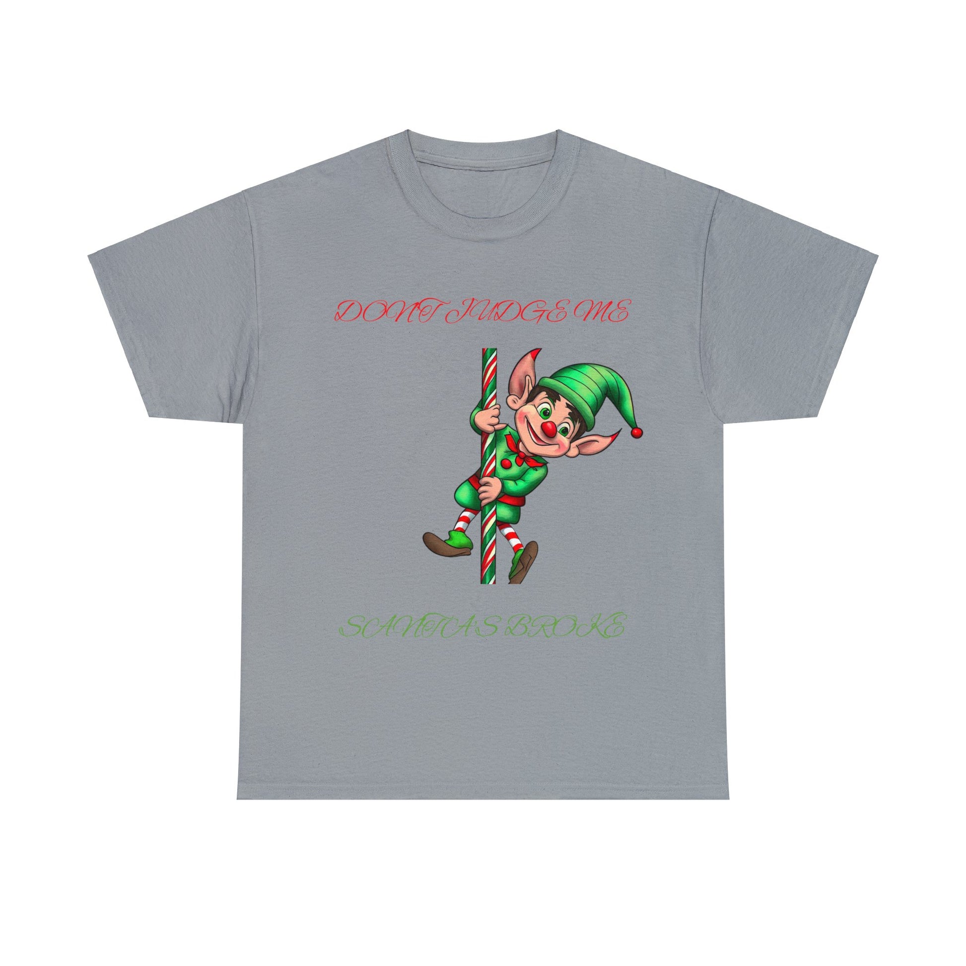 The Unisex Heavy Cotton- Don't Judge Me Elf T-shirt is a gray shirt crafted from 100% cotton, featuring a cheerful elf holding a candy cane. The text reads, "DON'T JUDGE ME, SANTA'S BROKE." It offers a classic fit perfect for celebrating the holiday spirit.