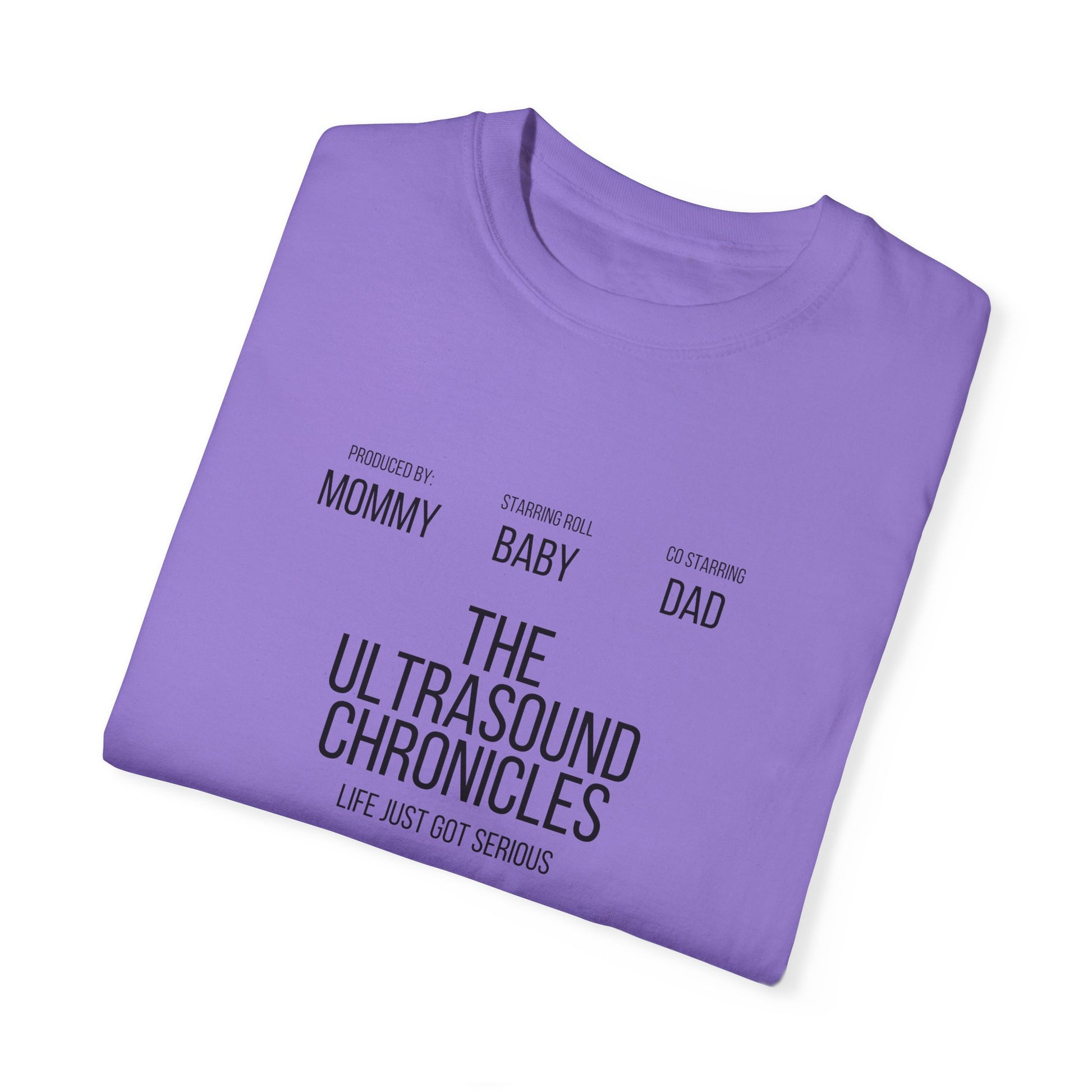 The Stylish Comfort with Unisex Comfort Colors 1717 Garment-Dye T-shirt, featuring the message: "The Ultrasound Chronicles. Produced by Mommy. Starring role Baby. Co-starring Dad. Life just got serious," delivers unmatched comfort and style as you embrace this exciting new chapter of life.