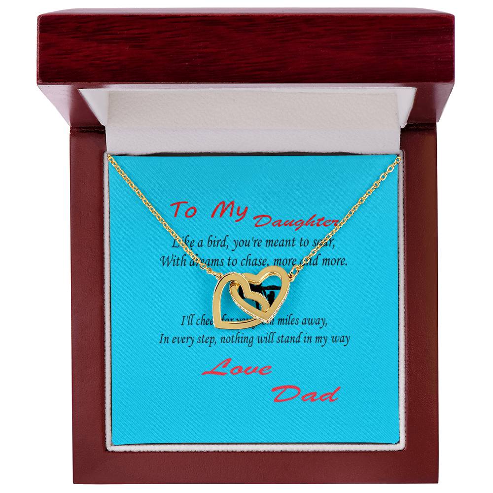 An Interlocking Hearts Necklace- Father Daughter Like a Bird lies elegantly in a red jewelry box with a blue background, accompanied by a heartfelt message reading "To My Daughter" from "Love Dad." This cherished gift is a beautiful way to celebrate an amazing dad on Father's Day.