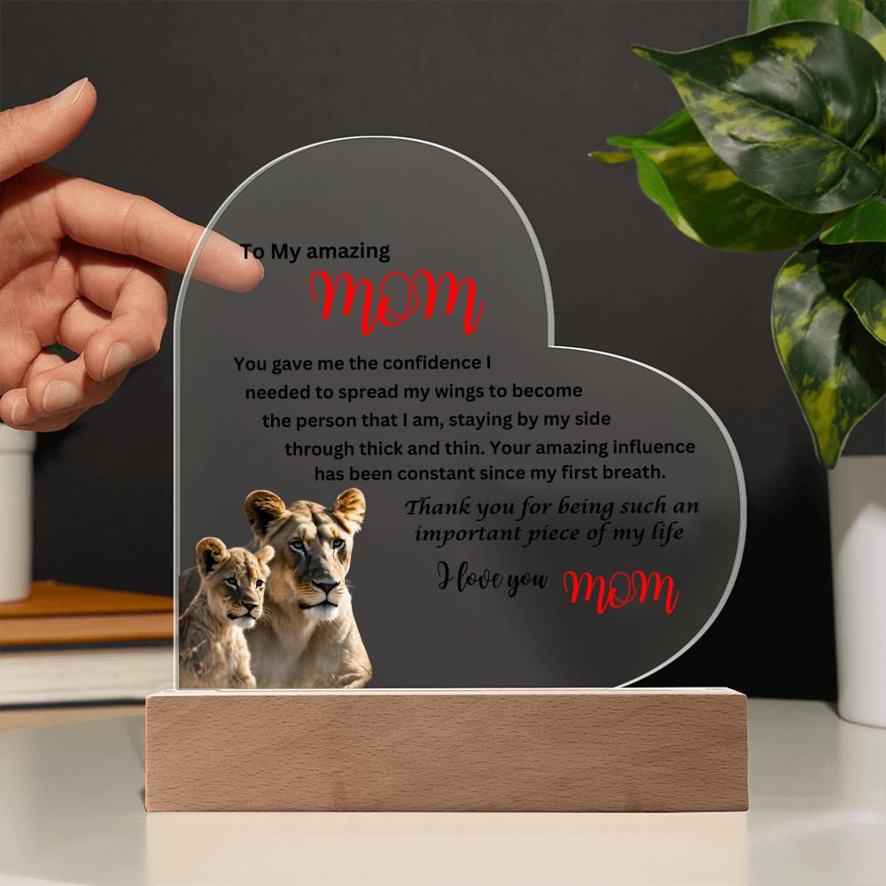 A beautiful gift for Mom, a To my amazing mom lions acrylic heart plaque with wooden base.