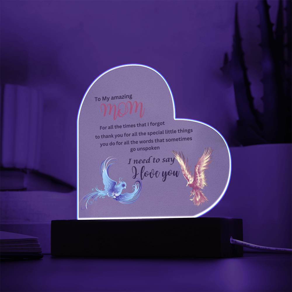 A heart-shaped Phoenix acrylic plaque with an image of a bird on it, perfect as a gift for mom.