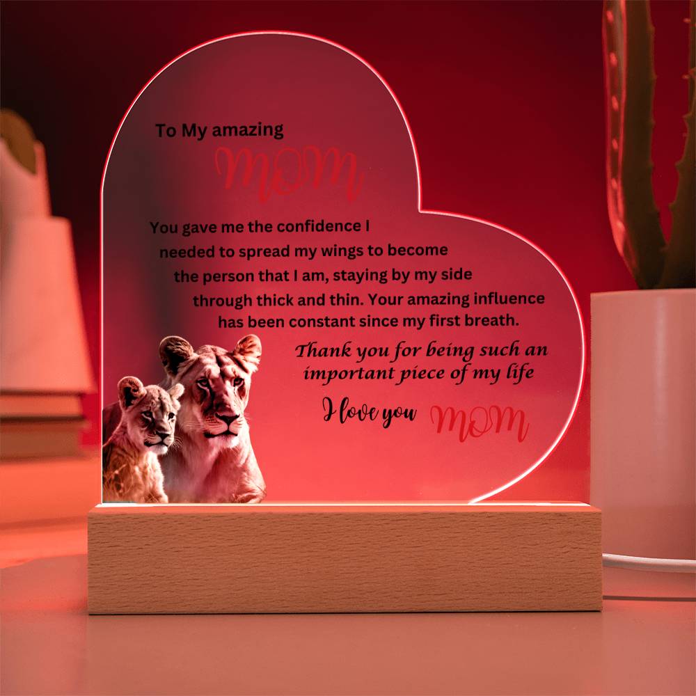 A To my amazing mom lions acrylic heart plaque with wooden base displaying an image of two lions, perfect as a gift for your mom.