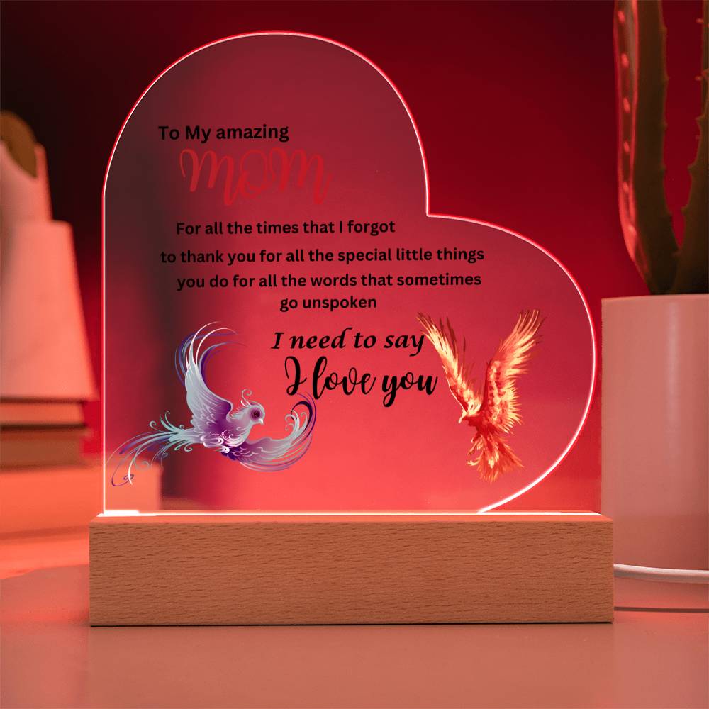 A heart-shaped phoenix acrylic plaque with an image of a bird and a heart - perfect for Mom as a gift.