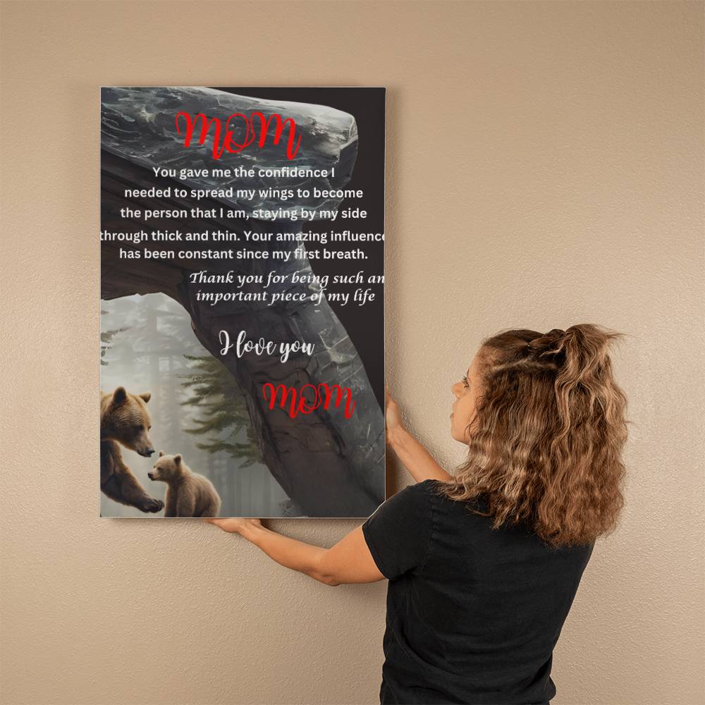 A woman is holding up a mom you gave me the confidence bear Gallery Wrapped Canvas, featuring unique design elements.